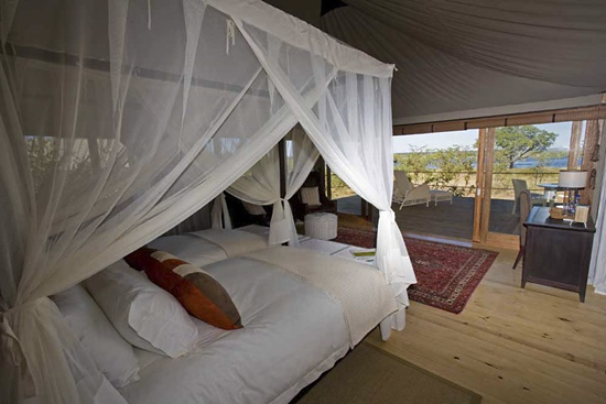 Guest bed and view at Toka Leya