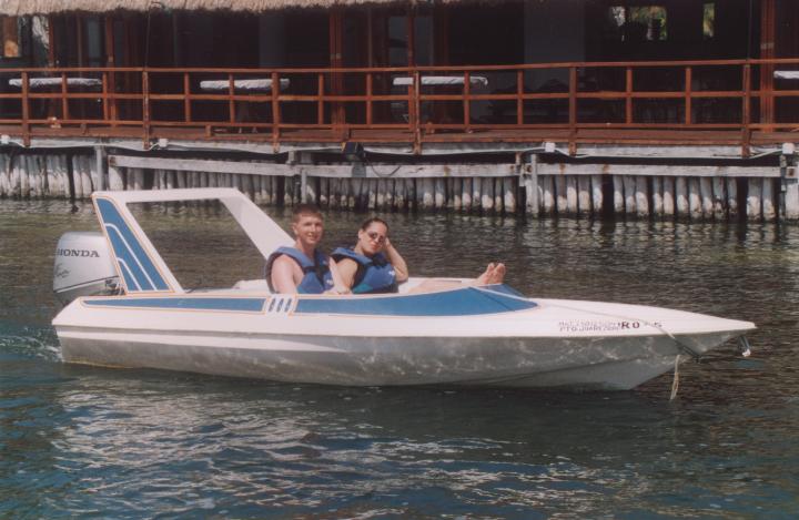 Cancun03ScottEmilyA.jpg - Scott and Emily in their speed boat (a tour)