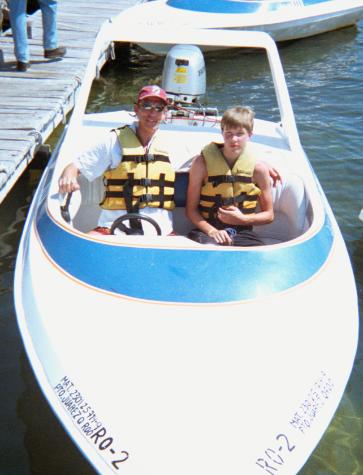 cancun1-21.jpg - Dad and Eric in their speed boat